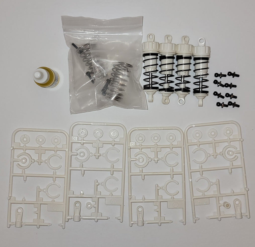 Tamiya Comical Frog OEM Shocks – White Replacement Suspension (Used, Like New)